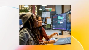 Two women looking at computer