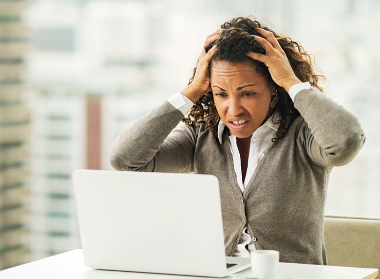 a person standing in front of a computer