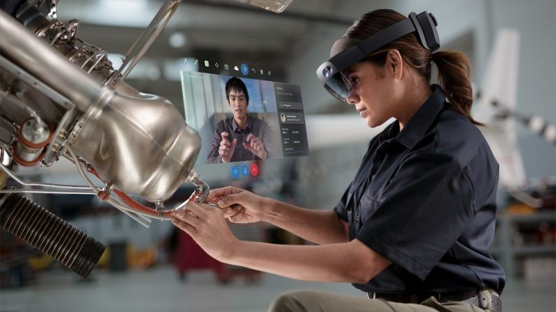 Woman using Dynamics 365 Remote Assist with HoloLens 2.