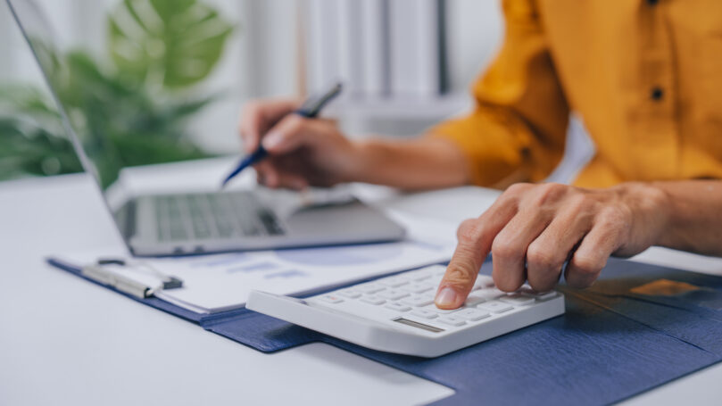 A person using a calculator