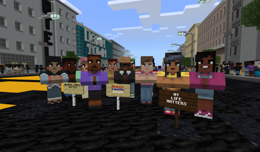 A group of activists stand in a city street holding signs reading 