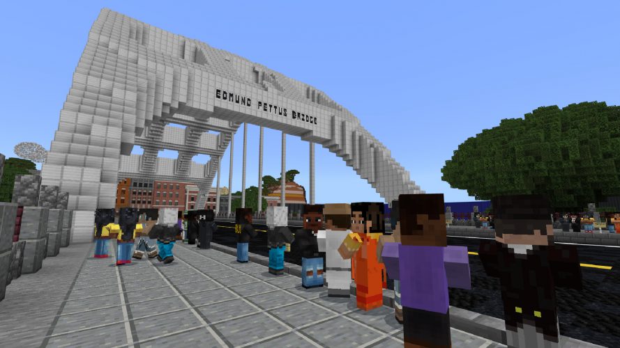 A large group of Civil Rights activists gather on the Edmund Pettus Bridge.