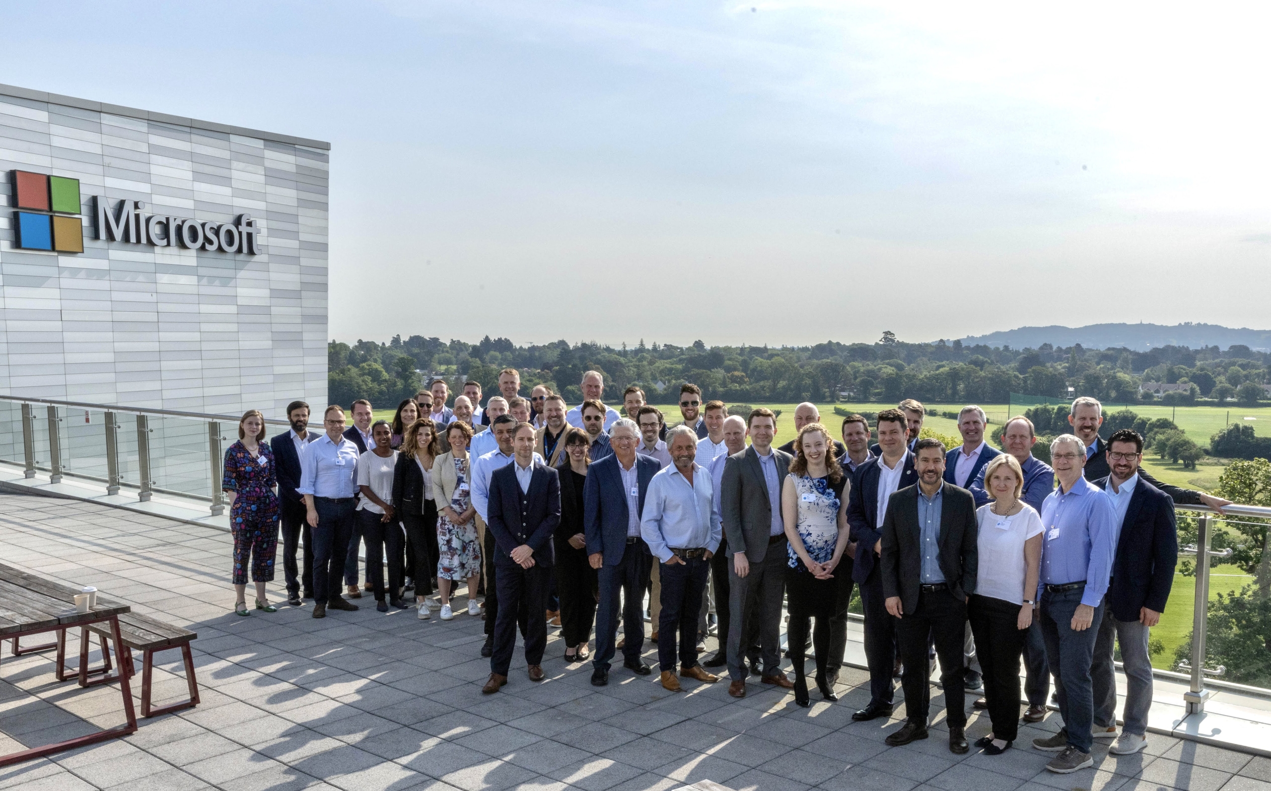 group of the members of the Decarbonization group positing in front of a Microsoft building.