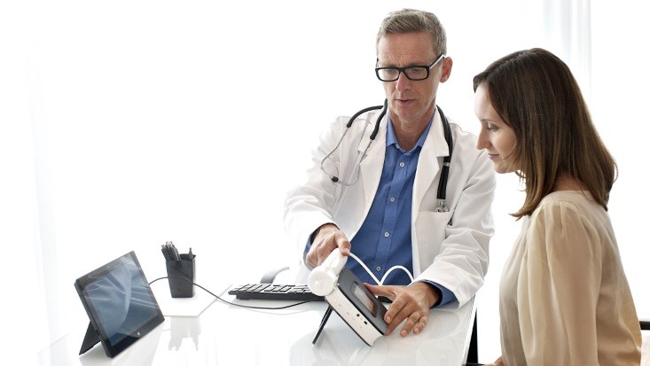 A doctor showing medical stuffs