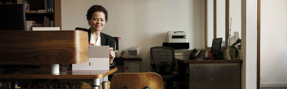Person working in an office on a tablet.