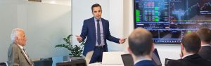 A man giving a presentation in a meeting.