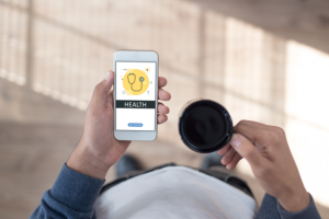 Person holding a phone looking at an application