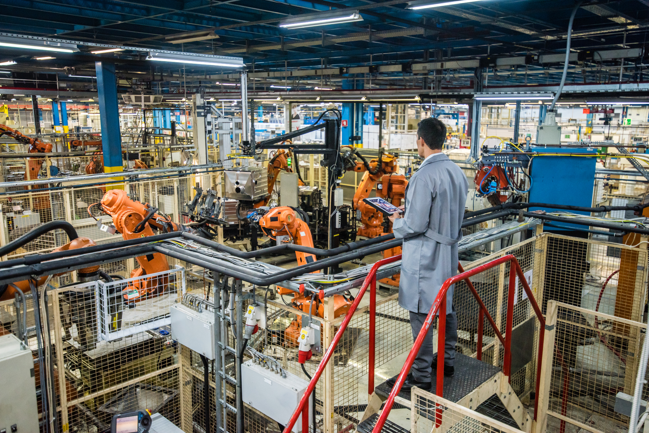 Factory engineer inspecting the work process