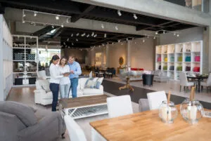 Two people shopping at a furniture store