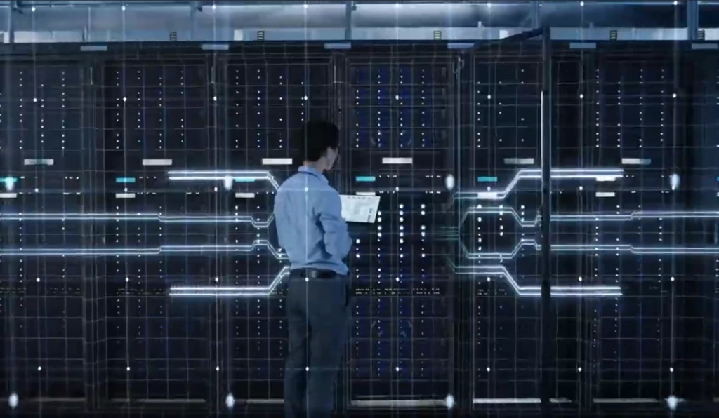 Man standing in front of servers