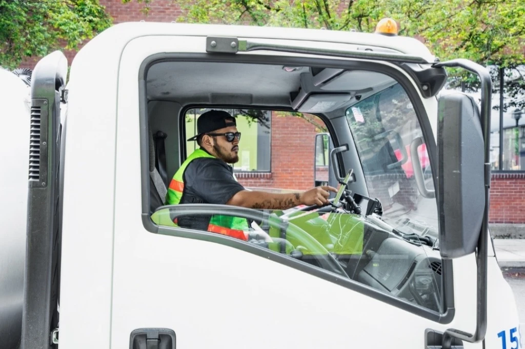 man driving garbage truck