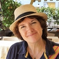 Photo of a smiling woman wearing a hat, Lesley Kipling