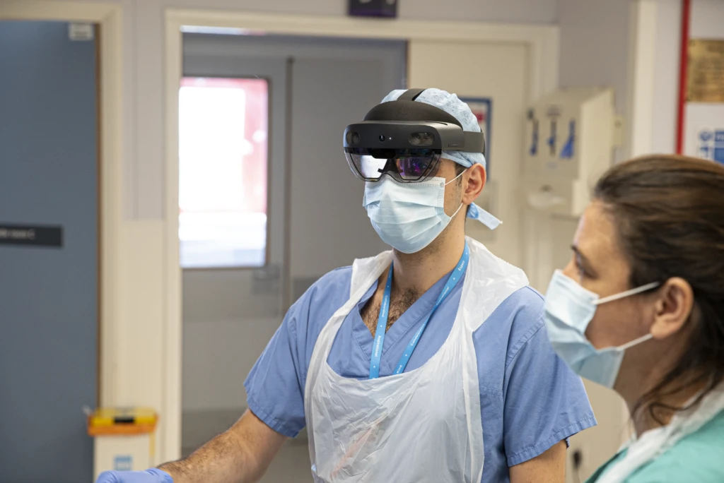 NHS doctors at St. Mary’s hospital from different specialities discuss a patient on a COVID-19 ward