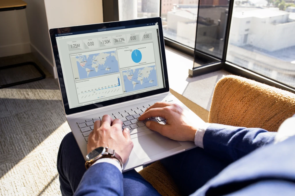 Dynamics 365 is a useful tool for the future of work. A woman works on a presentation using data and analytics.