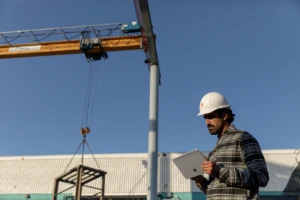 Man outside on construction site working Surface Go 2.