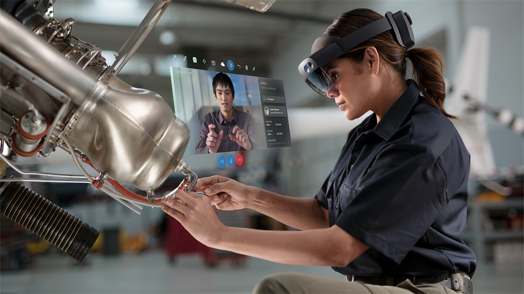 Woman using Microsoft Dynamics 365 Remote Assist in a manufacturing setting.