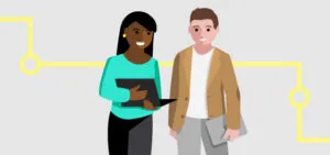 Two people holding laptops