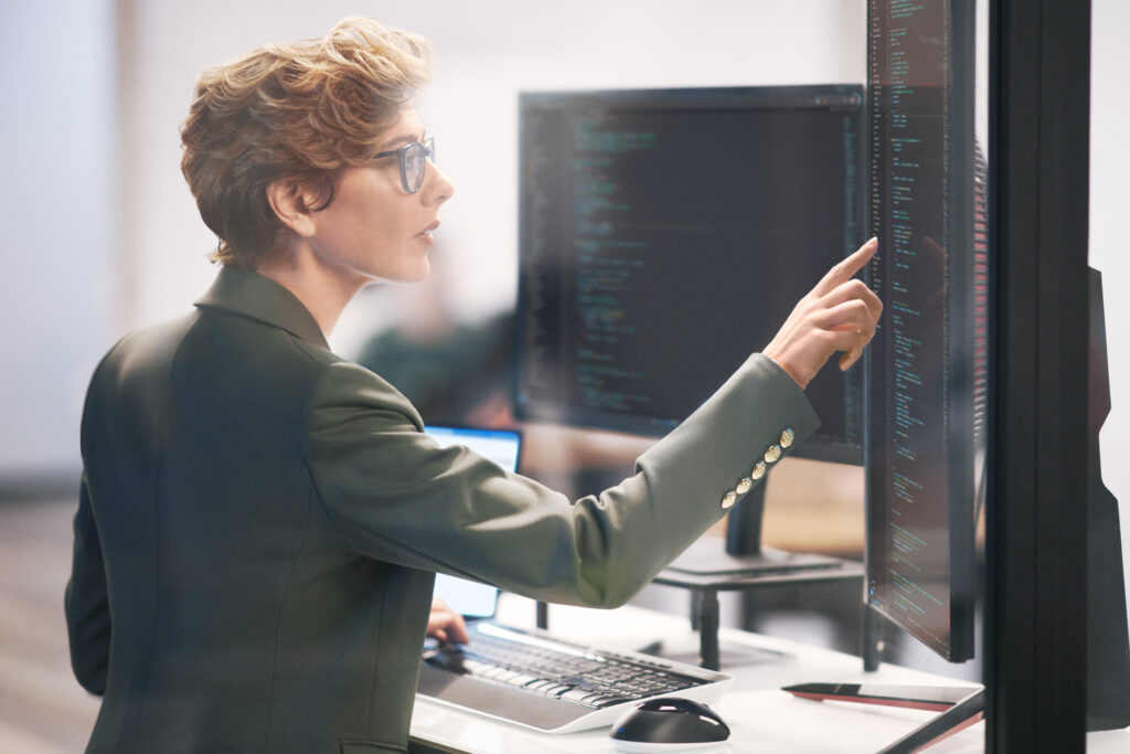 Developer evaluating data from intelligent apps built in Azure in the context of FinTech.