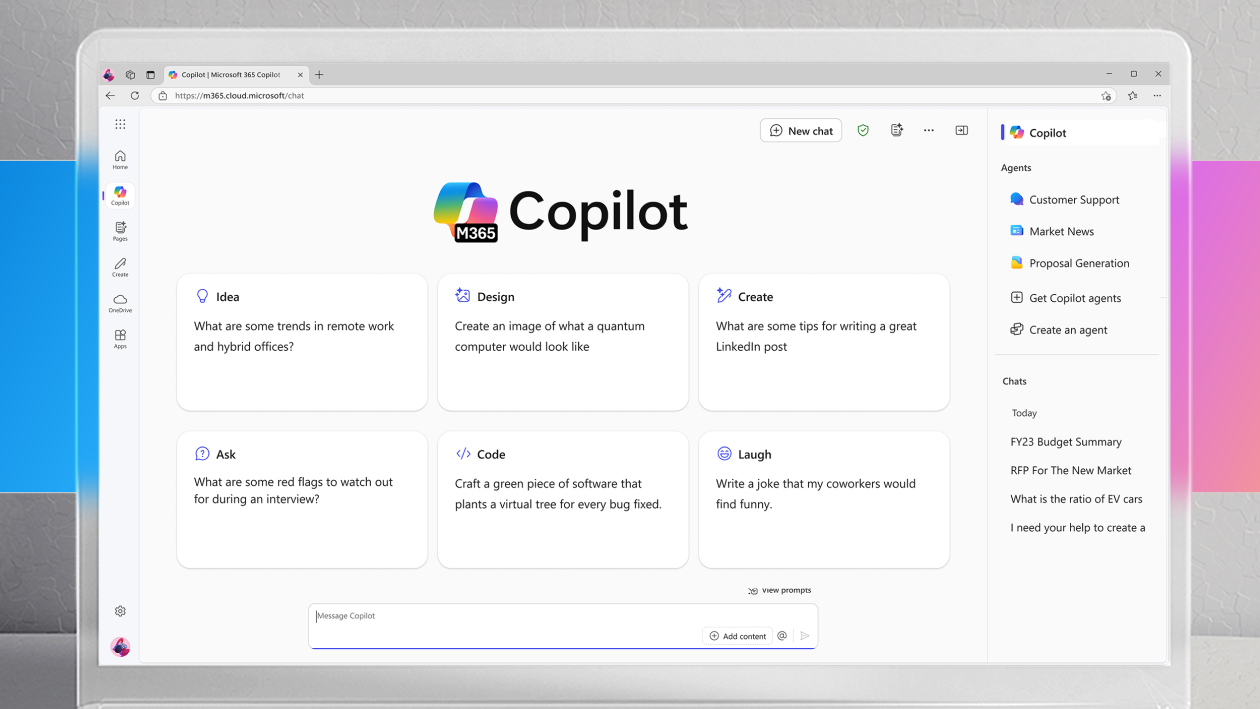 A monitor screen showing the Microsoft 365 Copilot landing page. Behind the monitor is a horizontal stripe that is blue and magenta gradient; the image is gray on the top and bottom.
