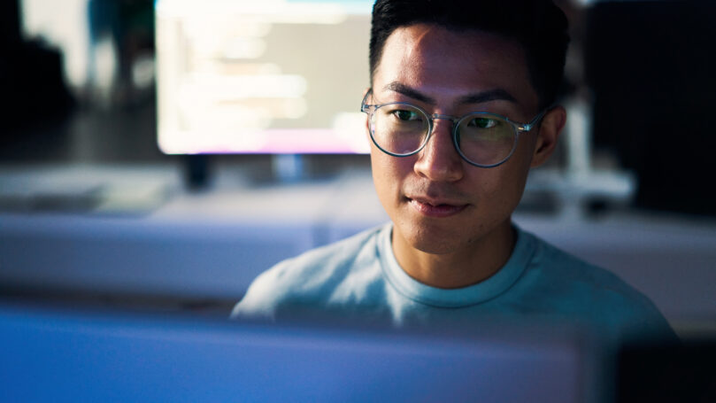 A man in glasses looking at the camera