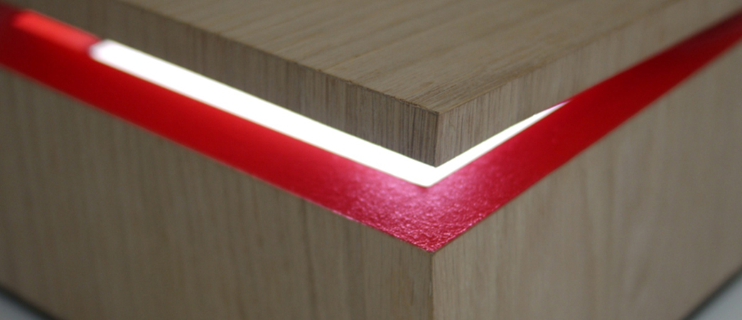 a sign on a wooden surface