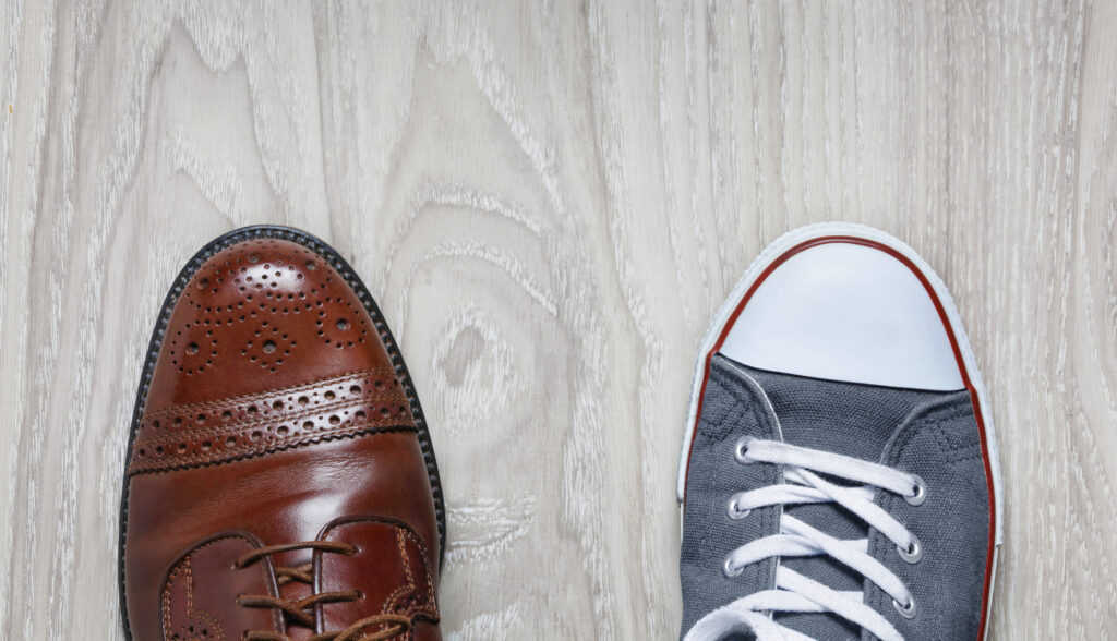 a business shoe and a tennis shoe