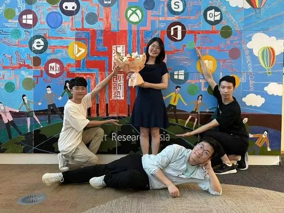a group of people sitting posing for the camera