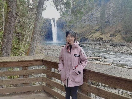 a person standing in front of a mountain
