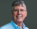 Michael Stonebraker smiling for the camera