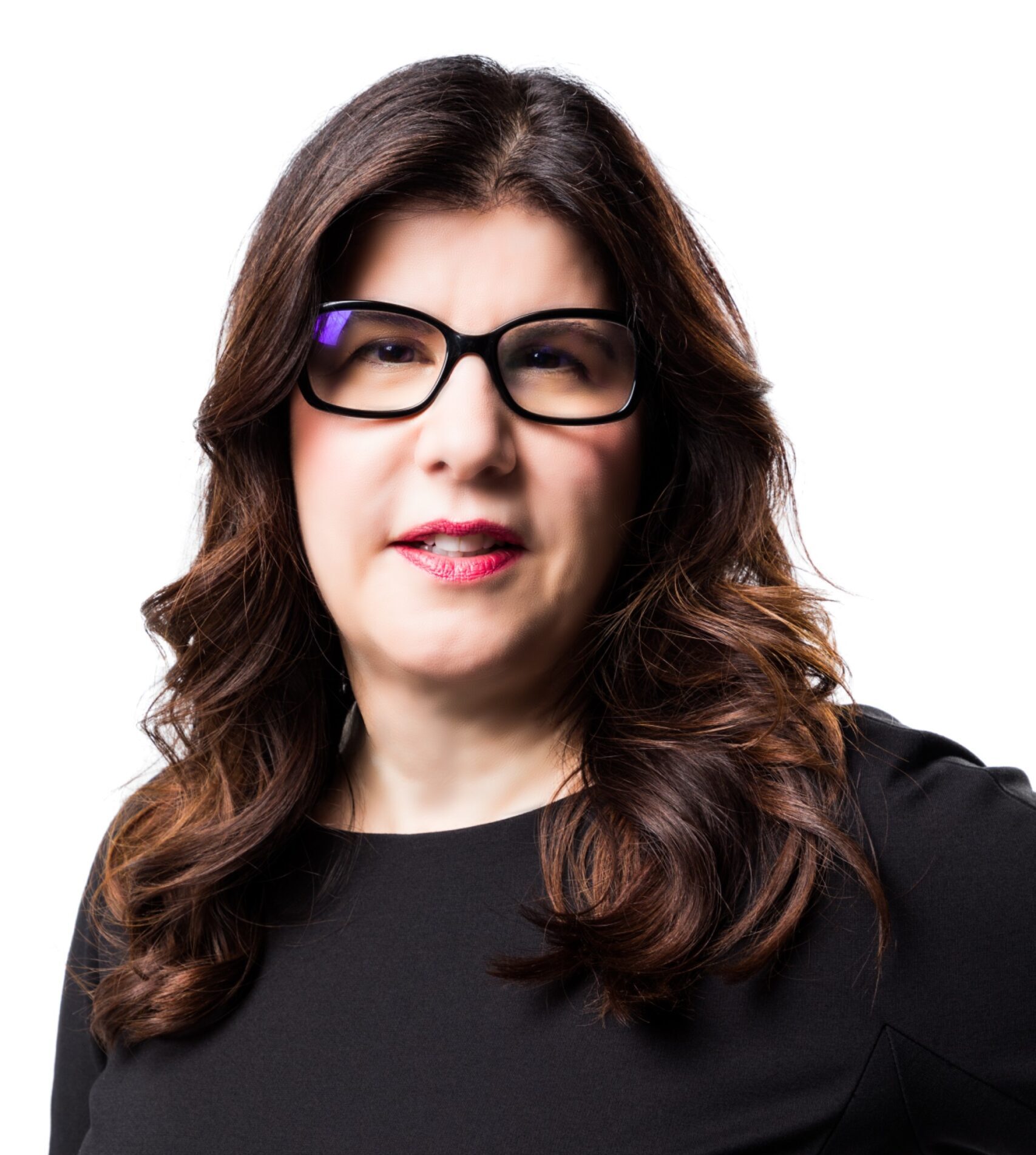 A woman wearing glasses and a black shirt