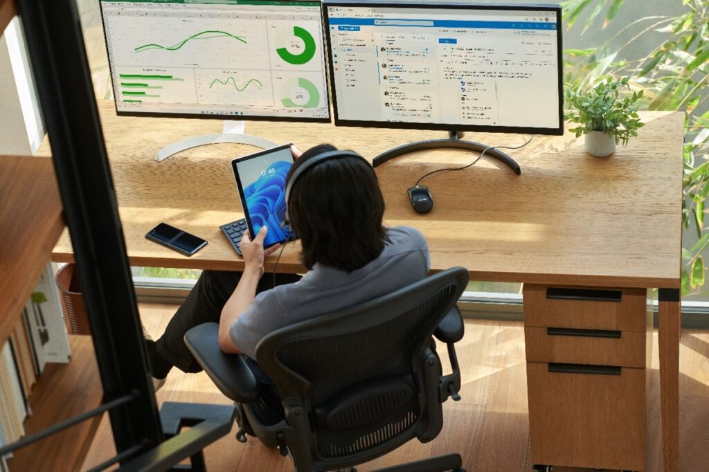 Security practitioner authenticating access on a Surface tablet while preparing to work from home. 