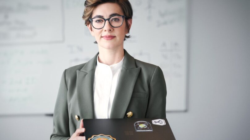 Empowered developer portrait, facing camera.