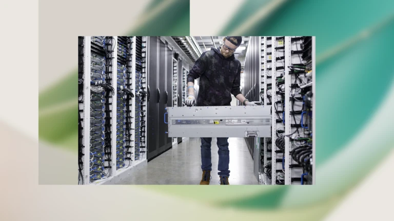 Decorative image of a person working in a data center.