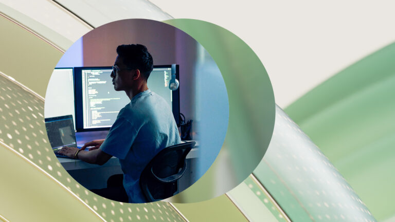 Decorative image of a person working at a desk.