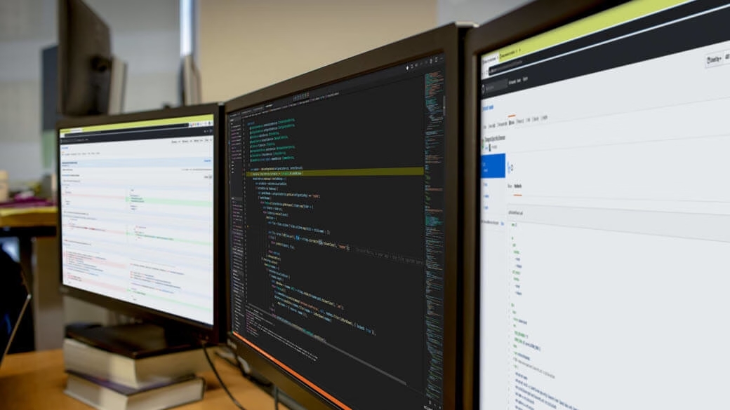 Multi-monitor developer workspace.