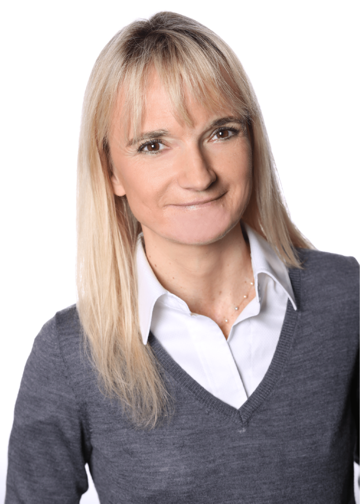 D’Hers shown smiling in a headshot.