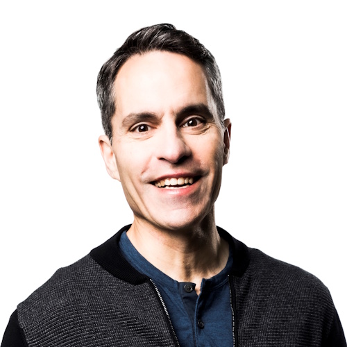 Teper smiles in a portrait photo. 