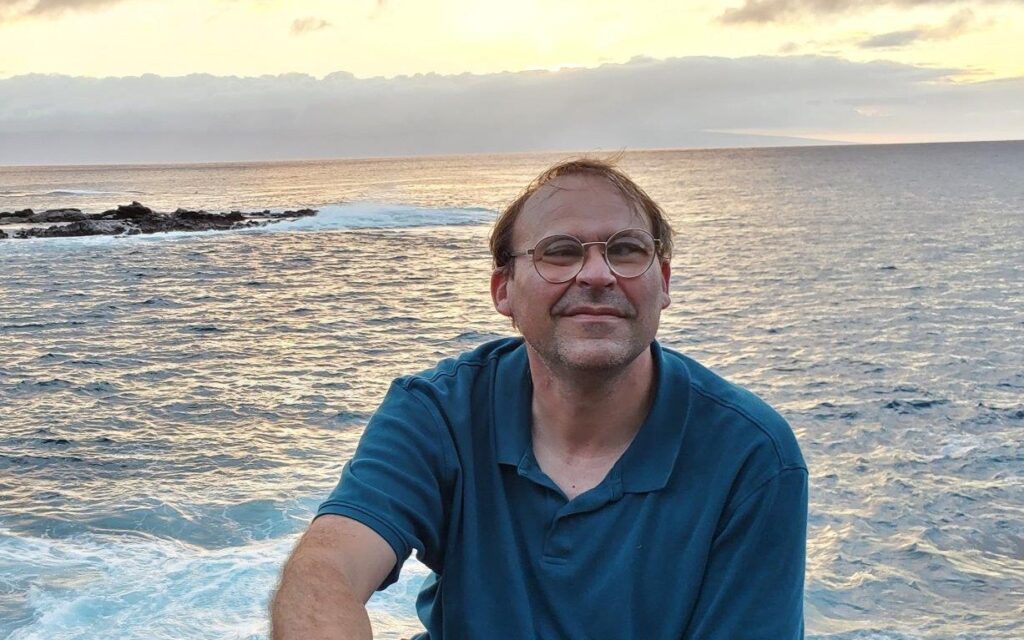 Johnson smiles in a portrait photo. 